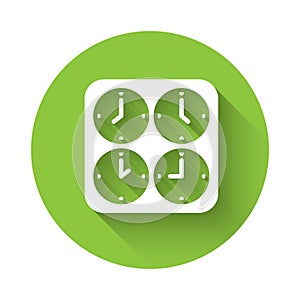 White Time zone clocks icon isolated with long shadow background. Green circle button. Vector