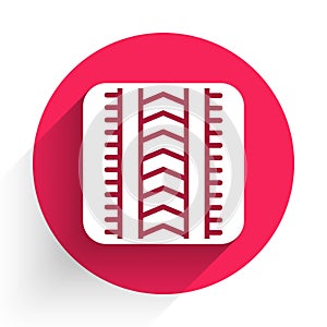 White Tire track icon isolated with long shadow. Red circle button. Vector
