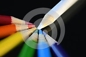 White to Rainbow Colored Pencil Bundle on dark glass