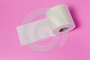 white toilet paper roll on pink