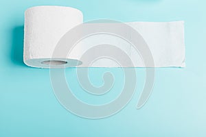 White toilet white paper on a blue background