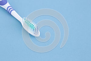 White toothbrushe on blue background, concept dental