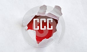 White torn paper with text CCC on red background