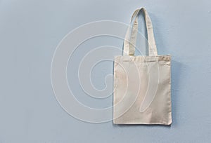 White tote canvas fabric eco bag cloth shopping sack on wall background / Zero waste