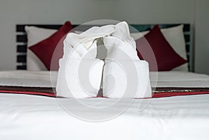 White towel on bed,Stack of plush hotel towels