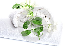 White towels with flowers for wellness