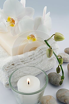 White towels and orchid, candle