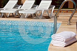 White towels by the pool.