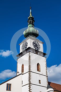 A white tower with blue sky in background