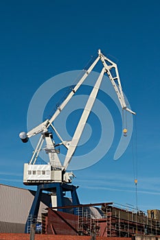 White Tower crane with blue sky photo