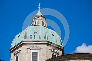 White tower,green roof,gold cross on top