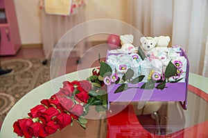 White toy doll . Bouquet of flowers in the opposite mirror . Reflection of a wedding bouquet in glass, mirror. A flowers
