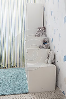 White toy storage rack in childrens`s room