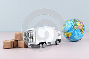 White toy truck with boxes on a light background, space for text.