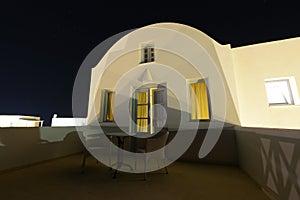 White traditional greek villa terrace under night stars