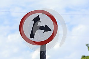 white traffic sign indicating two directions