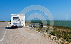 White Trailer road windmill north sea blue sky Netherlands camp trip