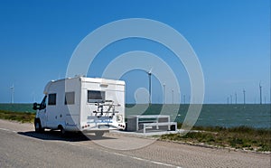 White Trailer road windmill north sea blue sky Netherlands camp trip