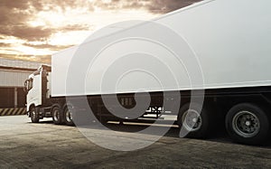 White Trailer Truck Parking at The Warehouse. Semi Truck. Road Freight Transportation and Logistics.