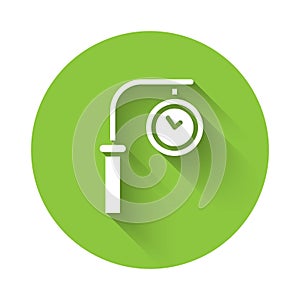 White Train station clock icon isolated with long shadow. Green circle button. Vector