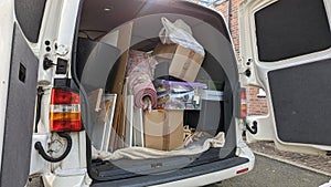 A white transporter van filled with house clearance household rubbish