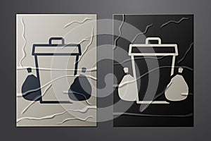 White Trash can icon isolated on crumpled paper background. Garbage bin sign. Recycle basket icon. Office trash icon