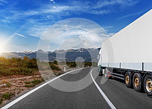 White truck on asphalt road