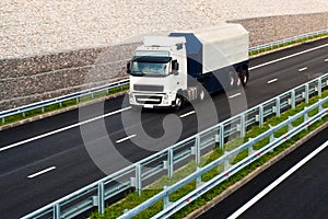 White truck on asphalt road