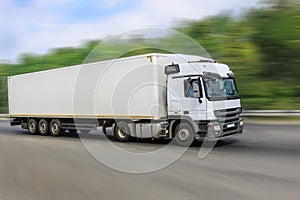 White truck goes on the highway