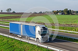 WHITE TRUCK ON THE HIGHWAY