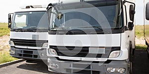 White truck in logistics parking lot ready for deliveries