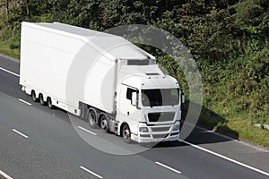 White truck on motorway in countryside