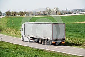 White truck moving on a main road