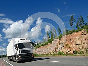 White truck on rocky highway