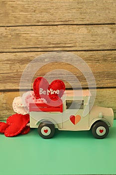 White truck with Valentine\'s day hearts vertical