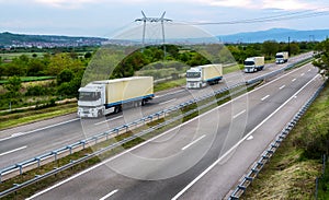 White trucks with yelliw trailers