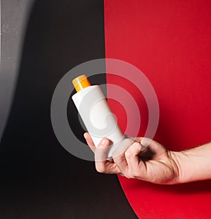 White tube bottle of shampoo, conditioner, hair rinse, mouthwash, on a background