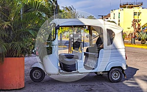 White tuk tuk tricycle TukTuks rickshaw in Mexico