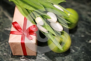 White tulip gift box green background