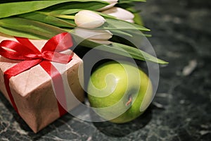 White tulip gift box green background