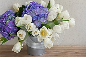 White tulips and blue hortensia flowers