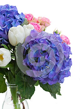 White tulips, pink roses and blue hortensia flowers