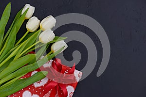 White tulips and red gift with heart print