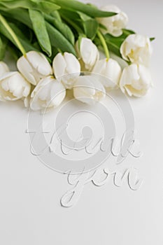 White Tulips with Thank You Message on Bright Background