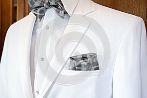 White tuxedo with silver plaid bow tie