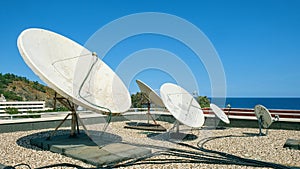 White TV rooftop aerials on the hotel in Turkey photo