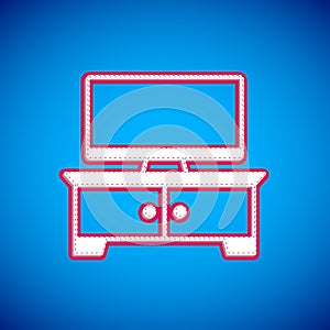 White TV table stand icon isolated on blue background. Vector