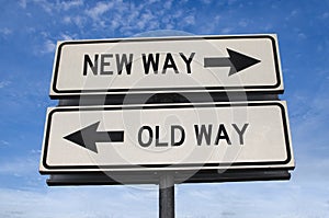 White two street signs with arrow on metal pole with word new way and old way