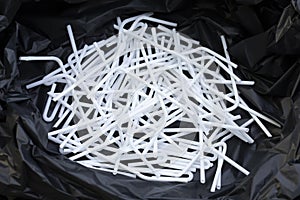 White UHT milk tube plastic in a garbage black bag