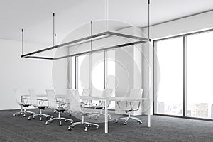 White ultra modern office meeting room side view